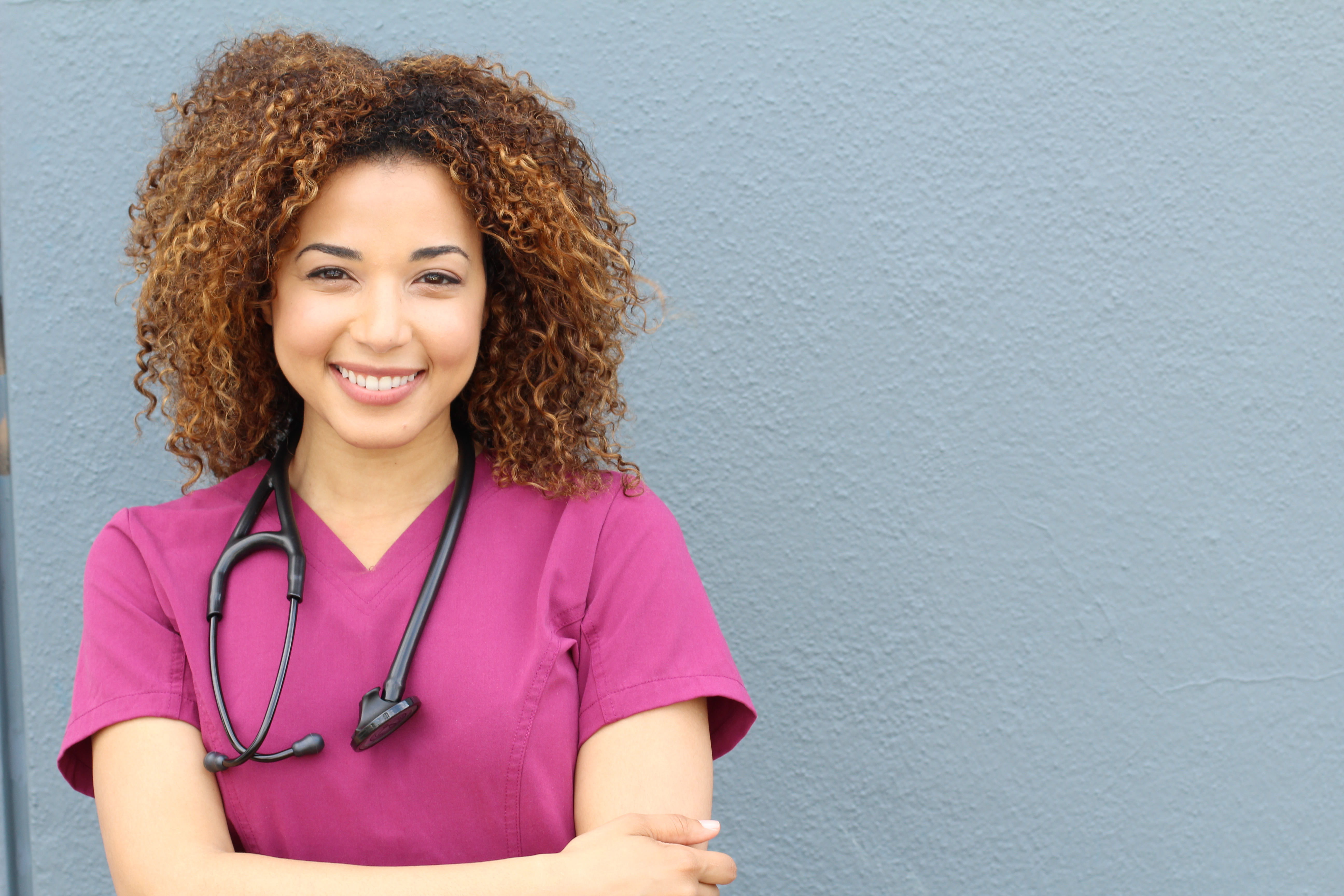 Studio shot of a beautiful female doctor - St. Peter Catholic School